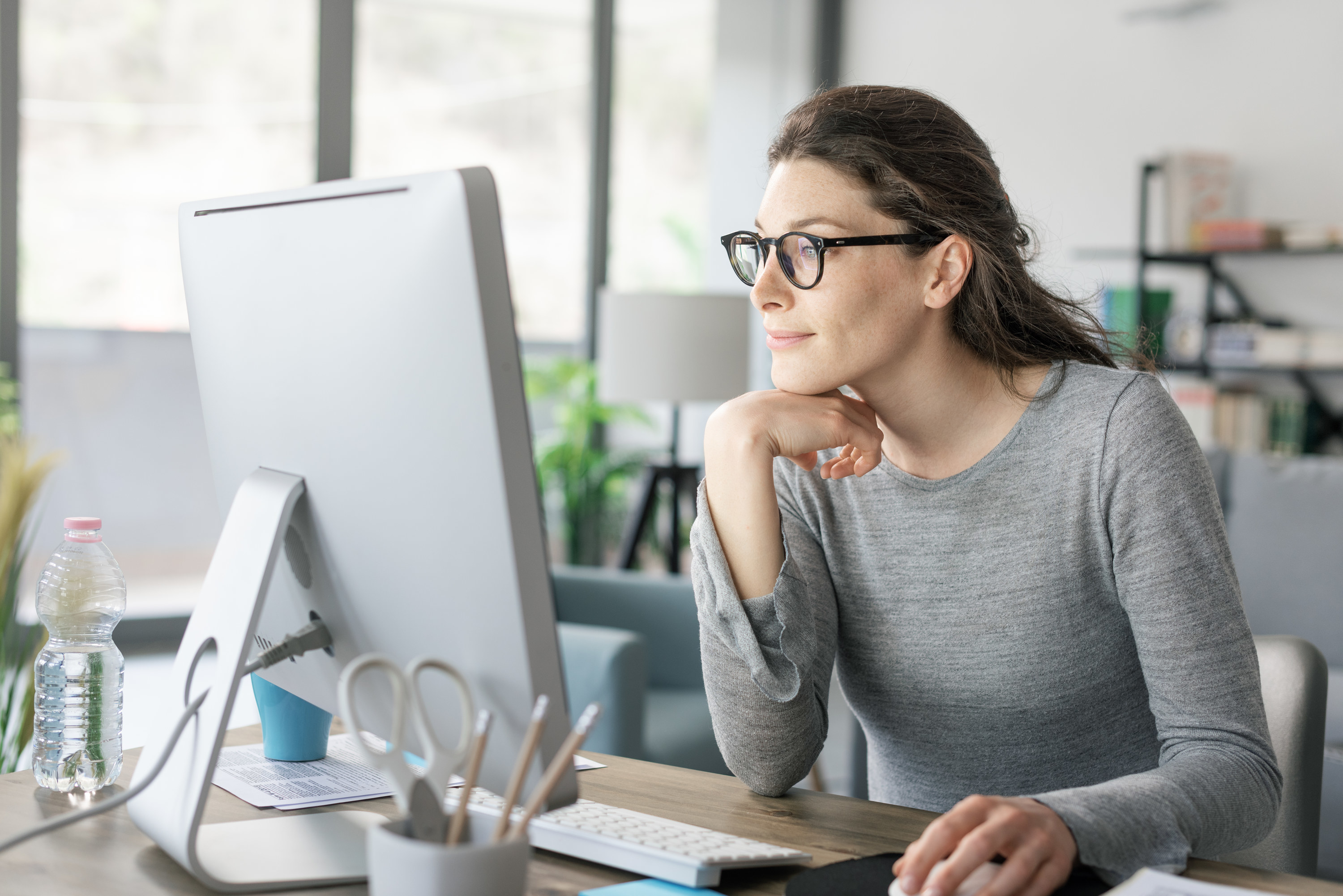 Woman working on her computer at home