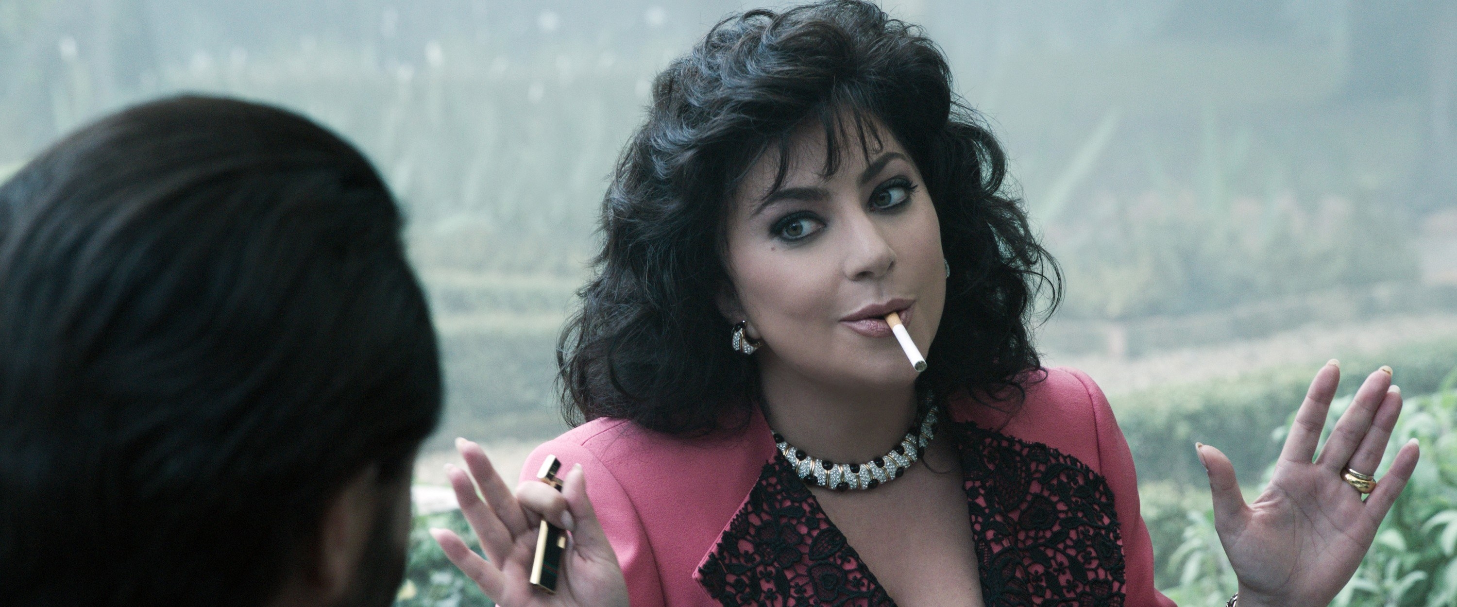 lady gaga with dark hair smoking a cigarette