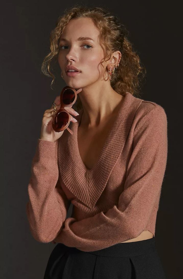 model wearing brown v-neck cashmere sweater
