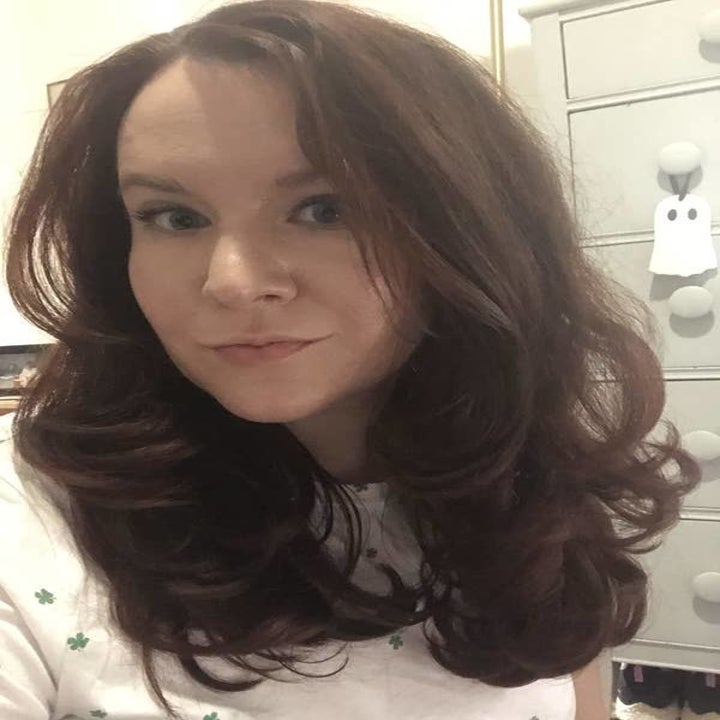 BuzzFeed editor Elizabeth Lilly with styled wavy hair after using the spray above