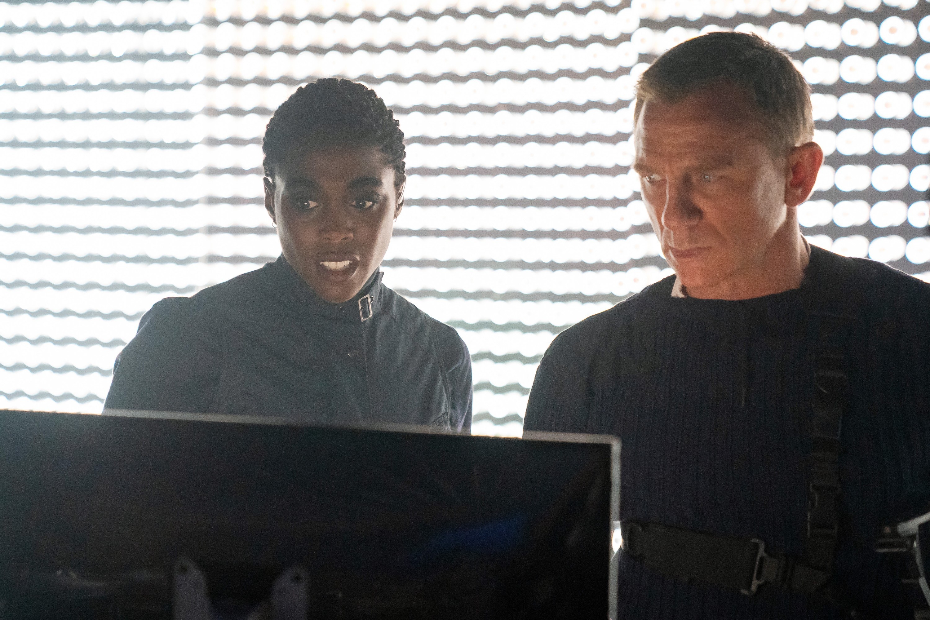 Lashana and Daniel Craig as Bond