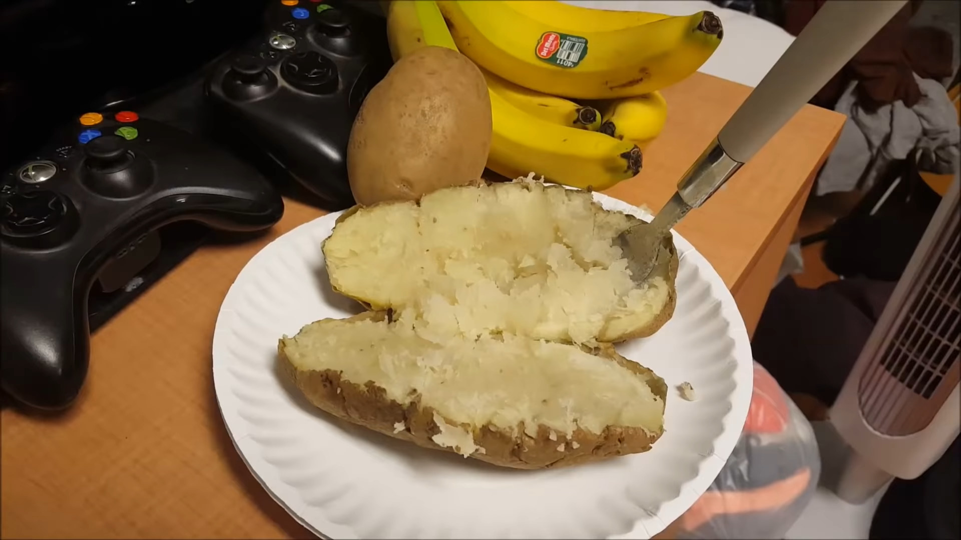 baked potato on a paper plate