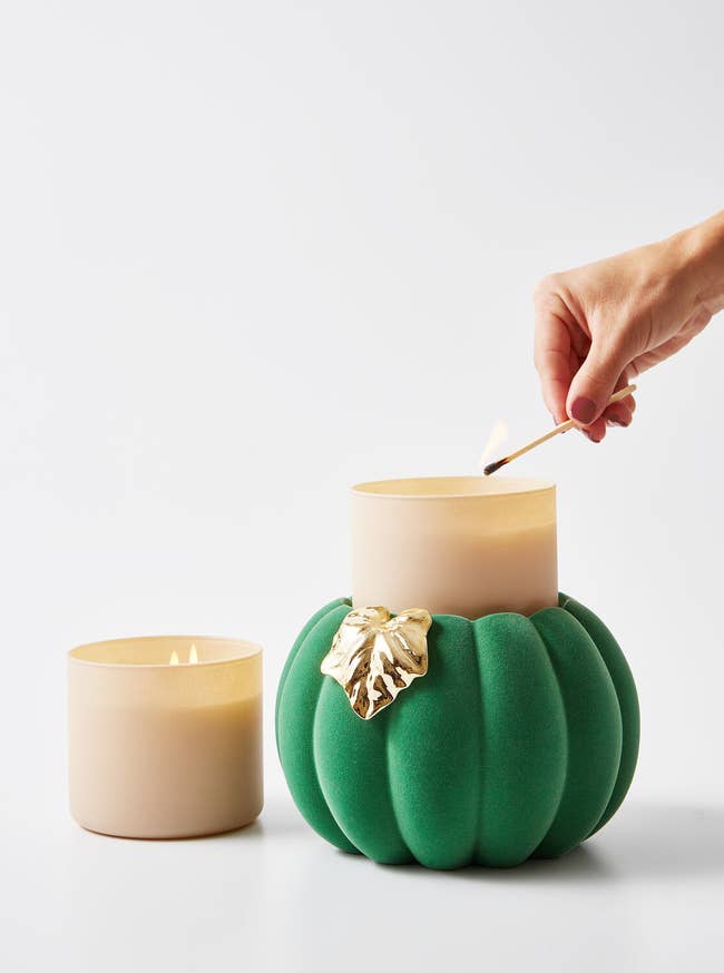 the green velvet pumpkin candle holder with a gold leaf accent