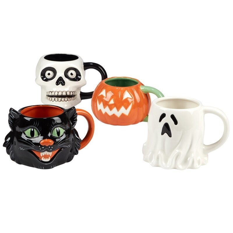 the mugs (one cat, one ghost, one pumpkin, and one skull)