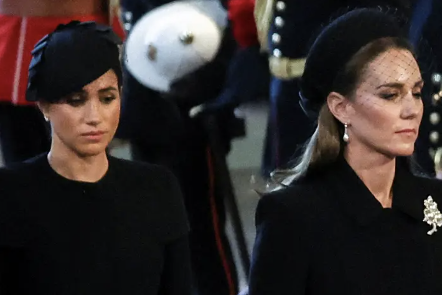 left: meghan markle in a black outfit and cap looking down; right: kate middleton in a black outfit and cap looking down