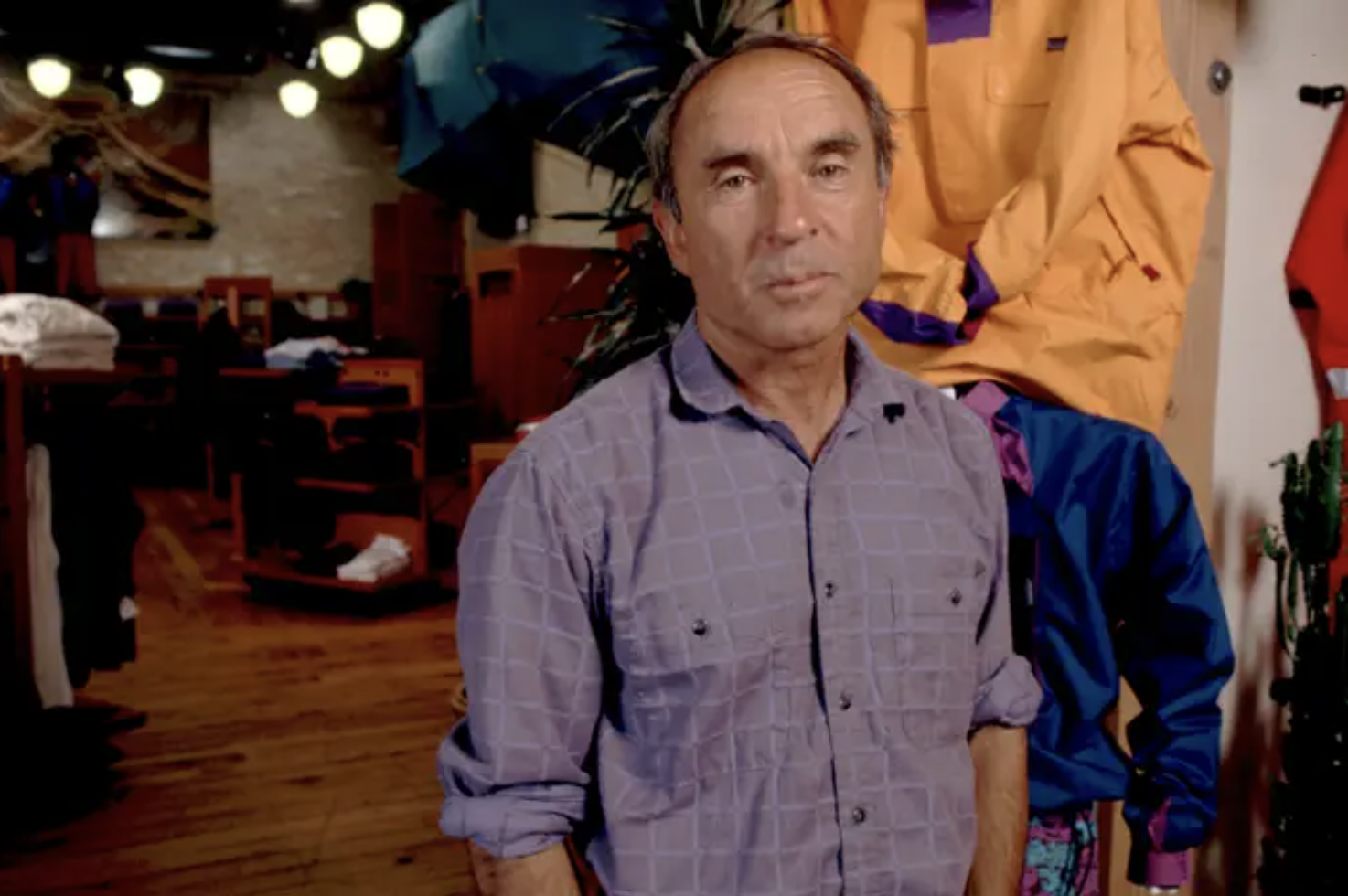 Yvon Chouinard looks downcast in a purple button down