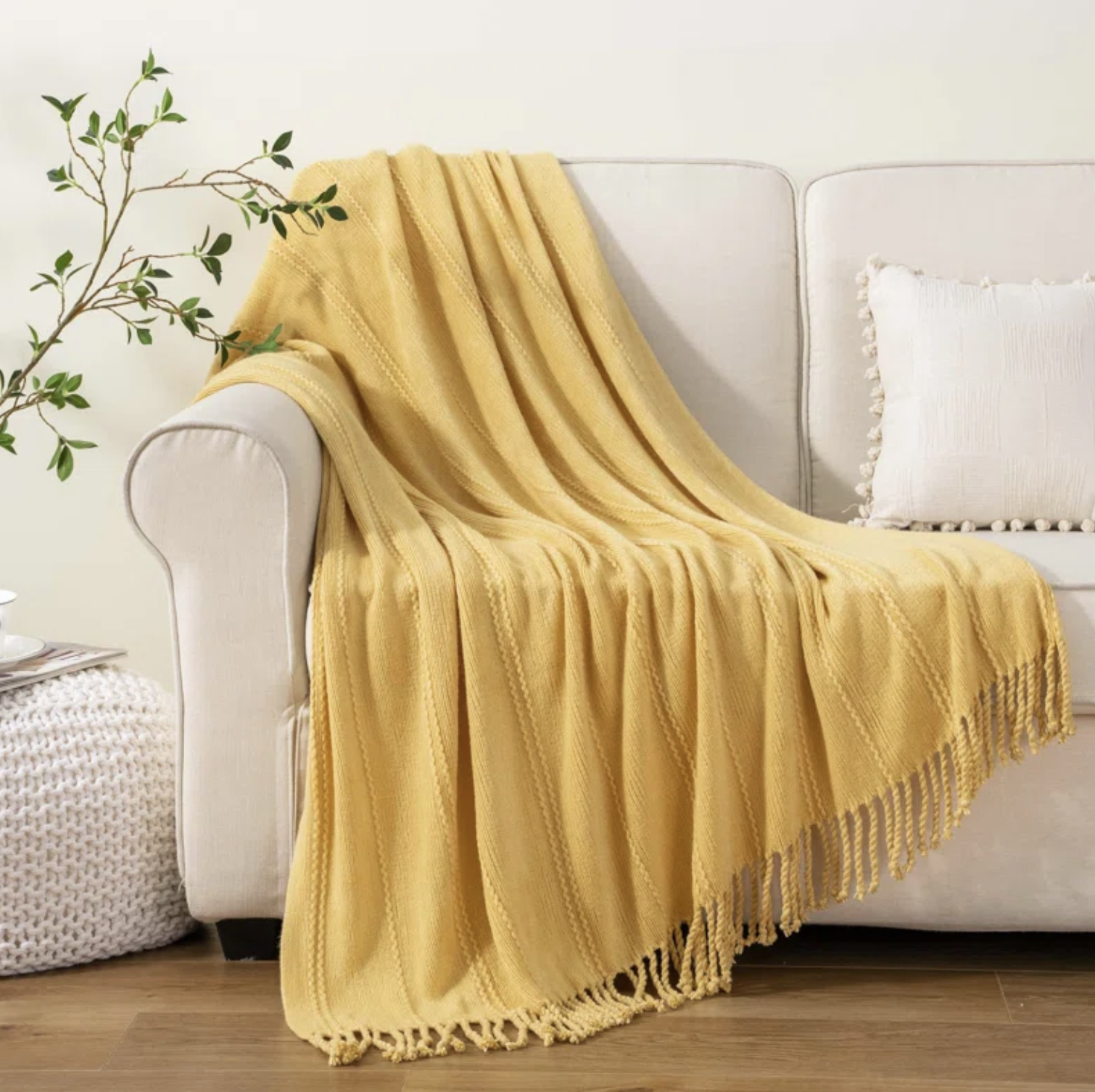 the yellow blanket draped over a couch