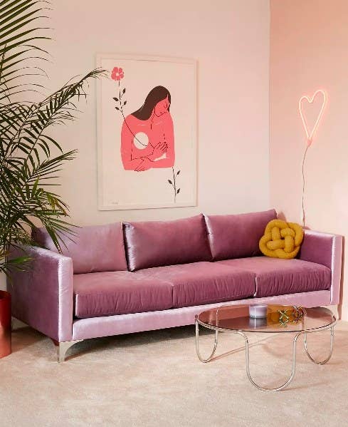 The sofa in pink in a living room