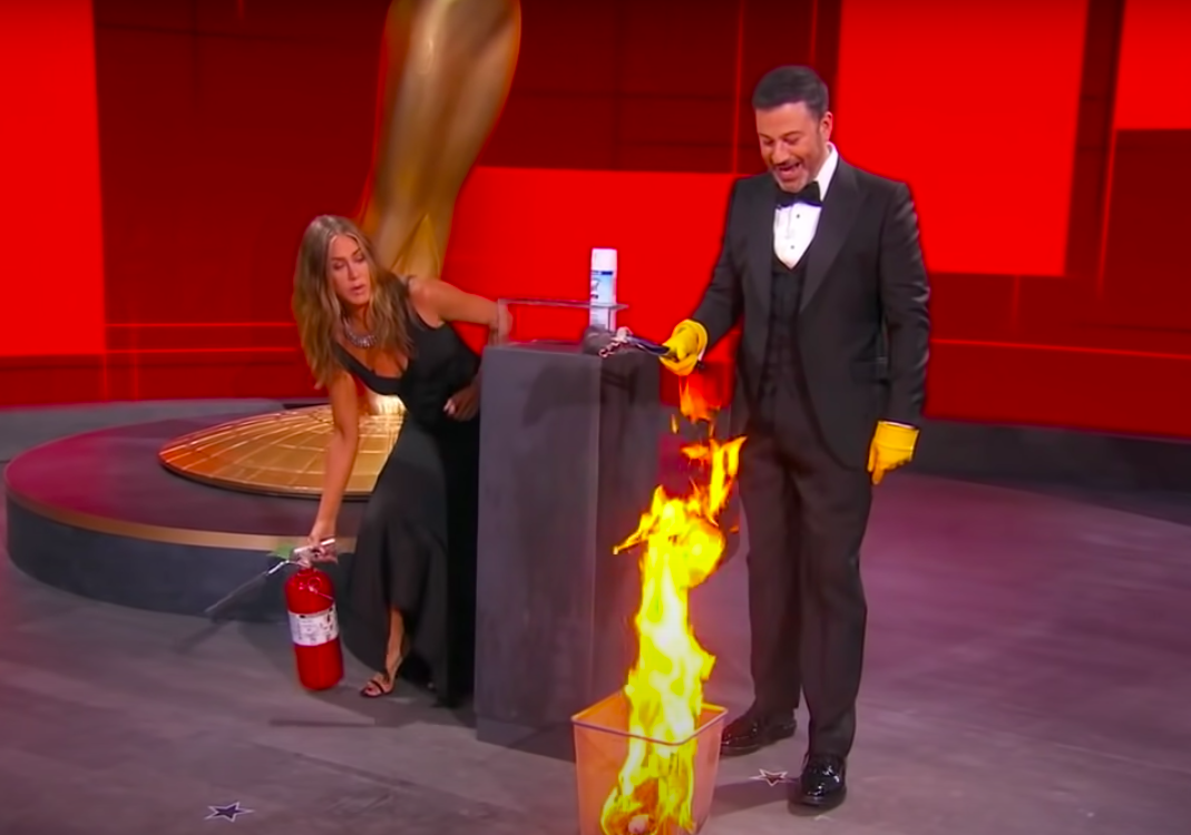 Jen bending down with the extinguisher