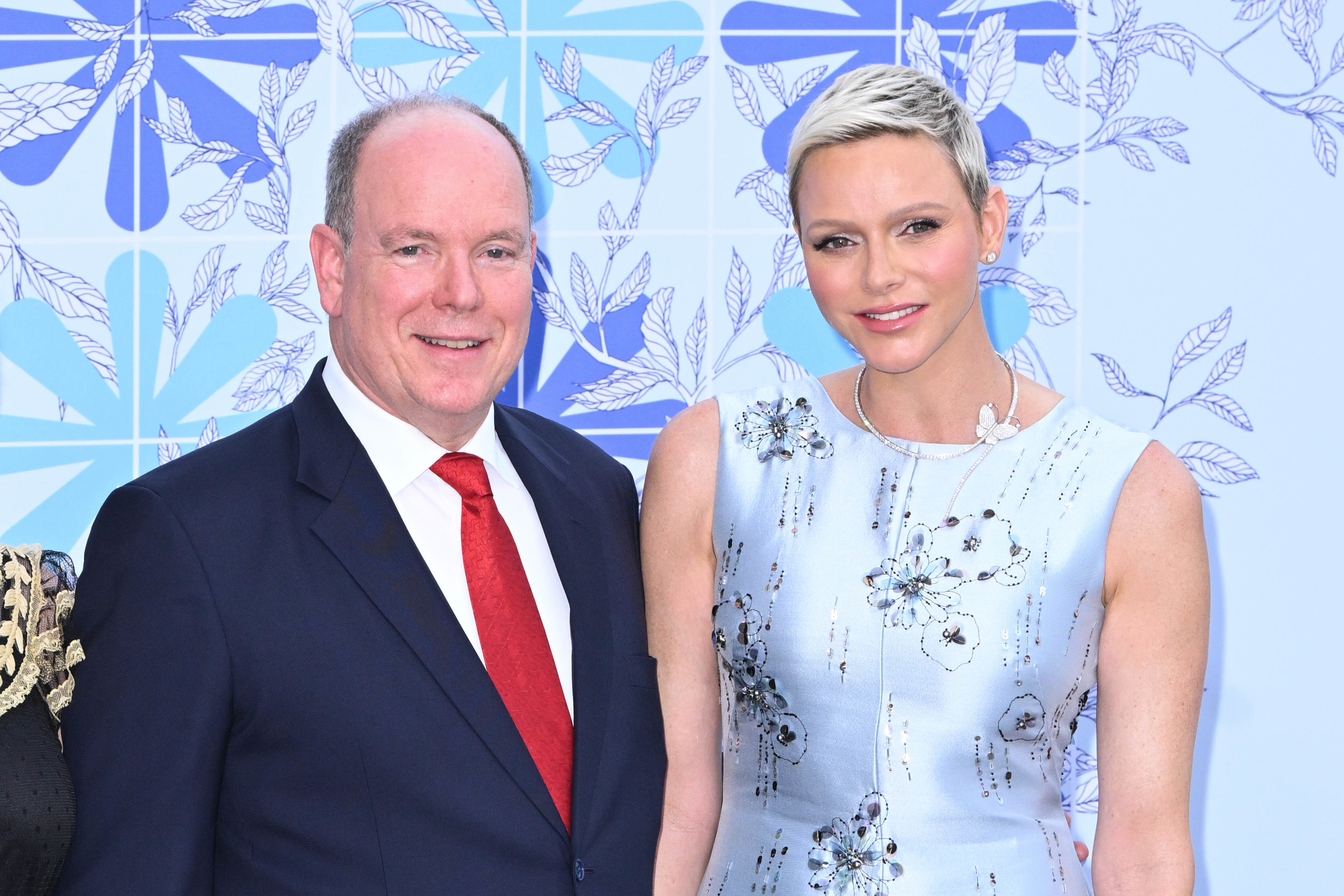 Prince Albert II and Princess Charlene standing next to each other and smiling
