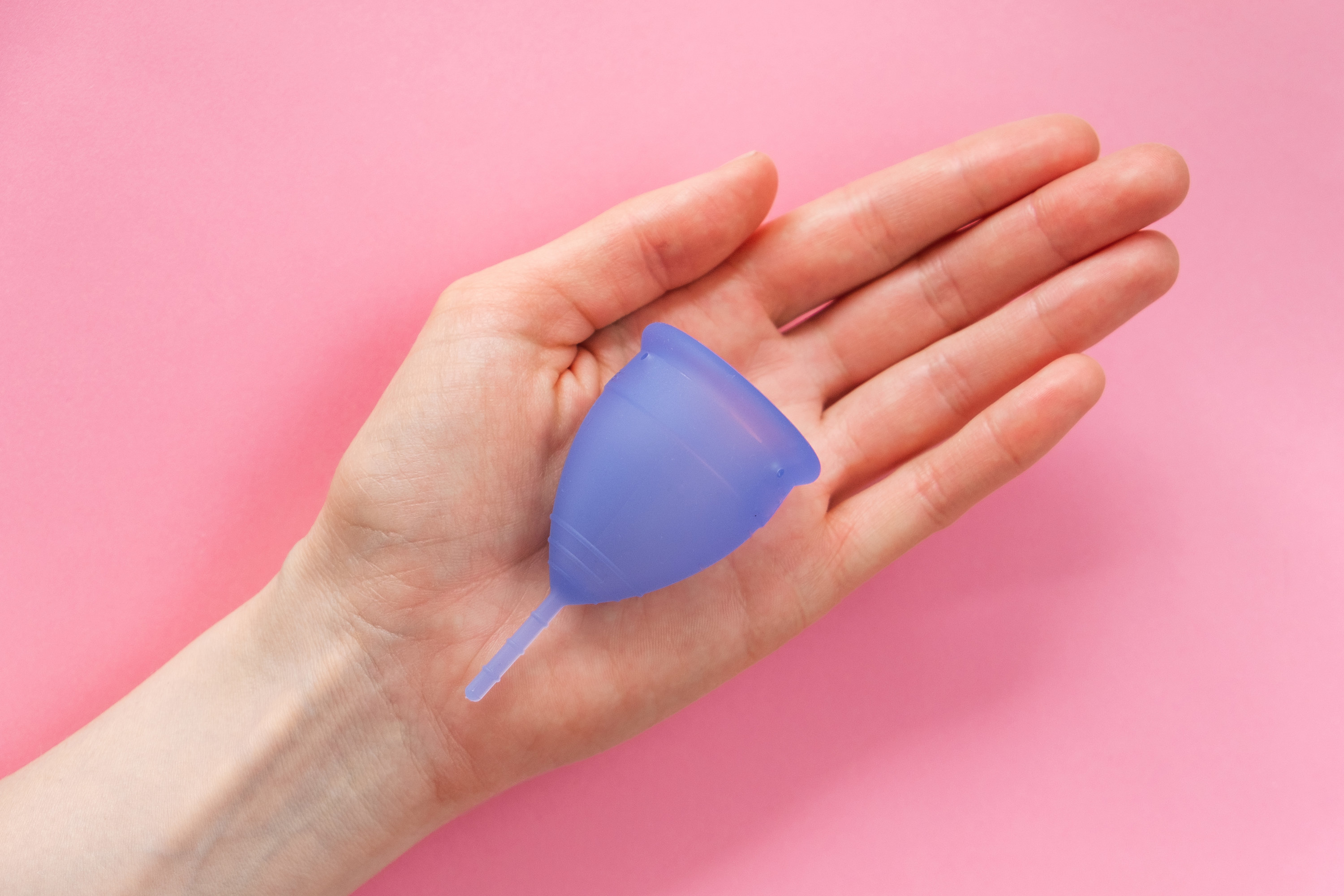 menstrual cup in someone&#x27;s hand