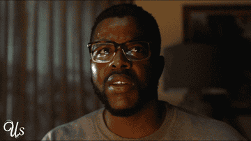 Winston Duke as Gabe Wilson in &quot;Us&quot; looking at his other
