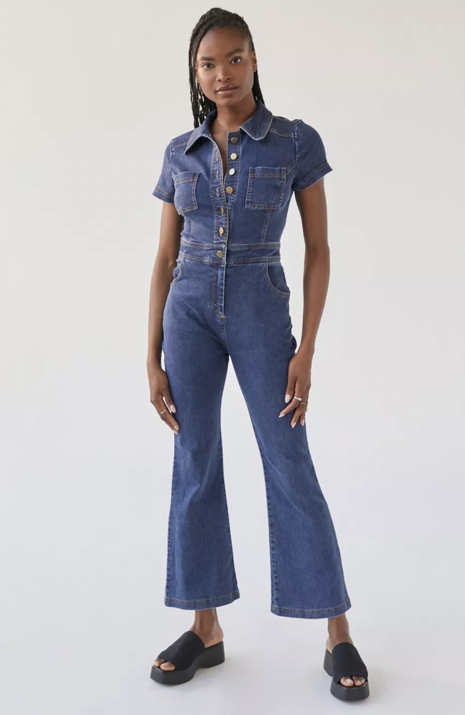 Model standing in the blue jumpsuit