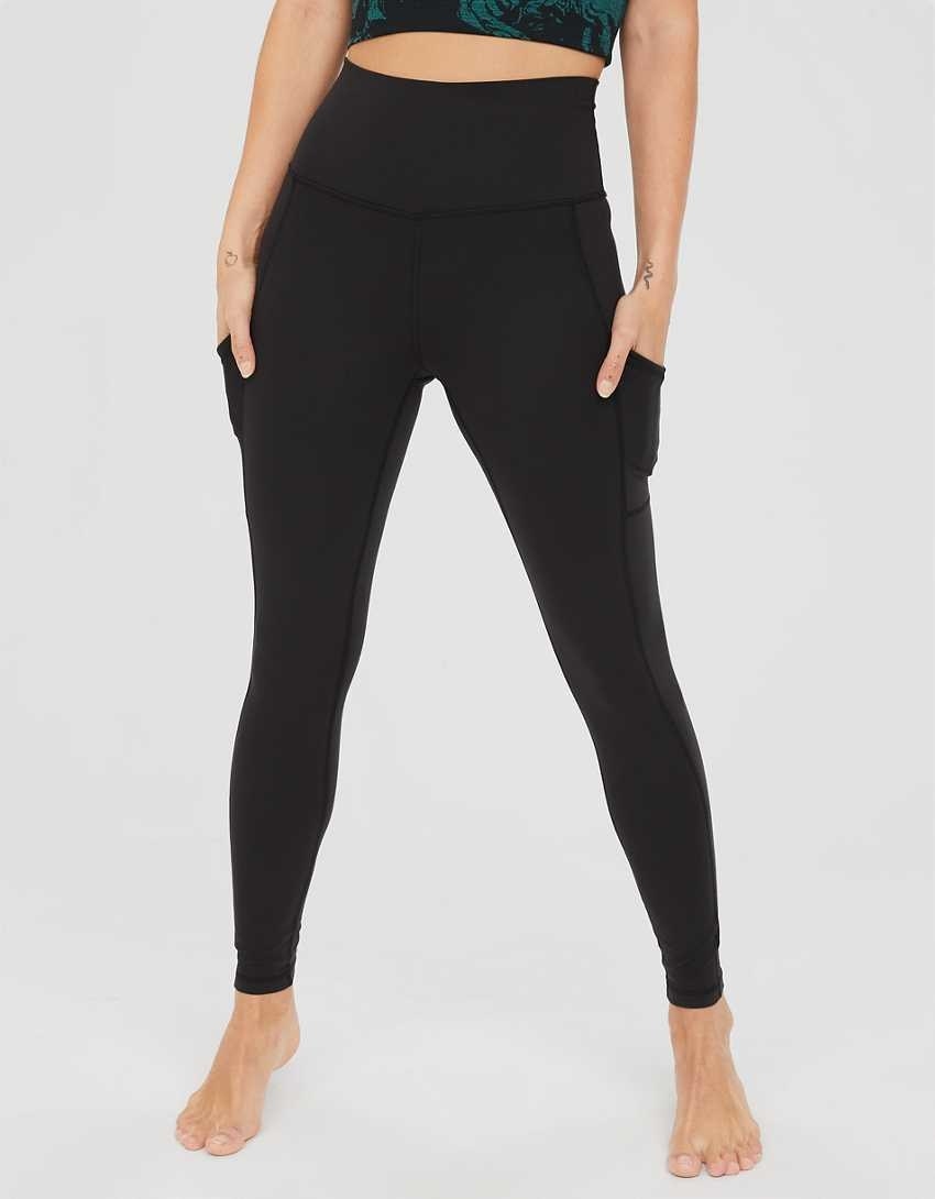 model in black high waisted leggings with side pockets
