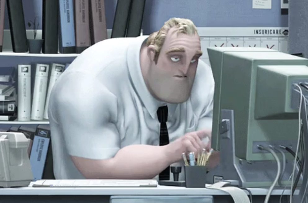 an animated man sitting in an office behind a computer