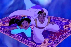 Aladdin and Princess Jasmine ride on a carpet