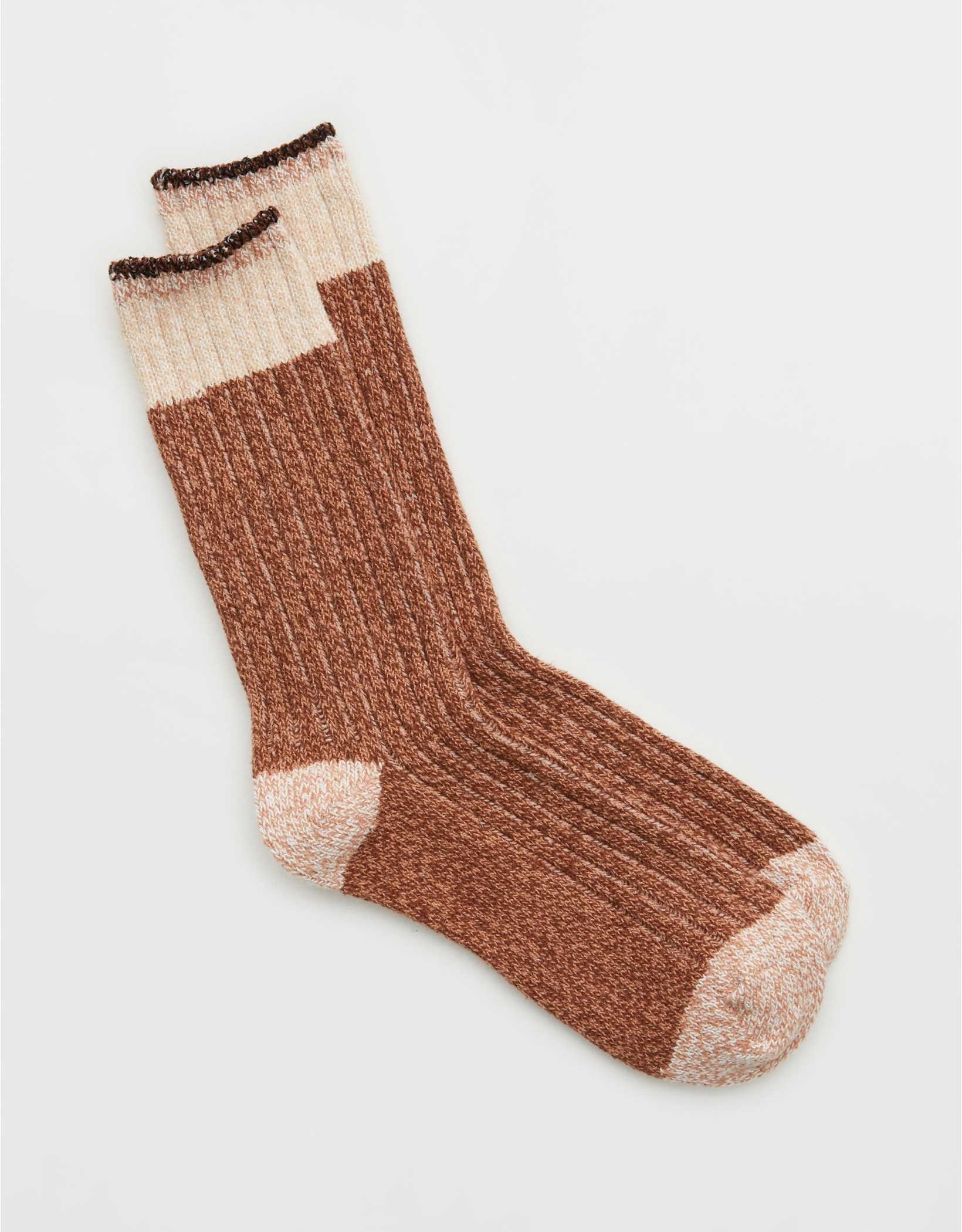 dark brown crew socks with tan toes, heels, and tops that also have extra stripes