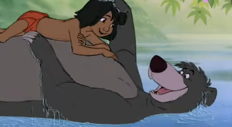 Mowgli lying on the bear&#x27;s tummy