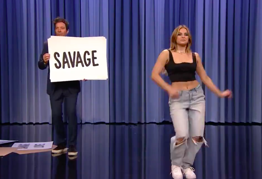 Jimmy onstage with Addison hold up a sign saying &quot;Savage&quot;