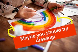 A person draws a rainbow