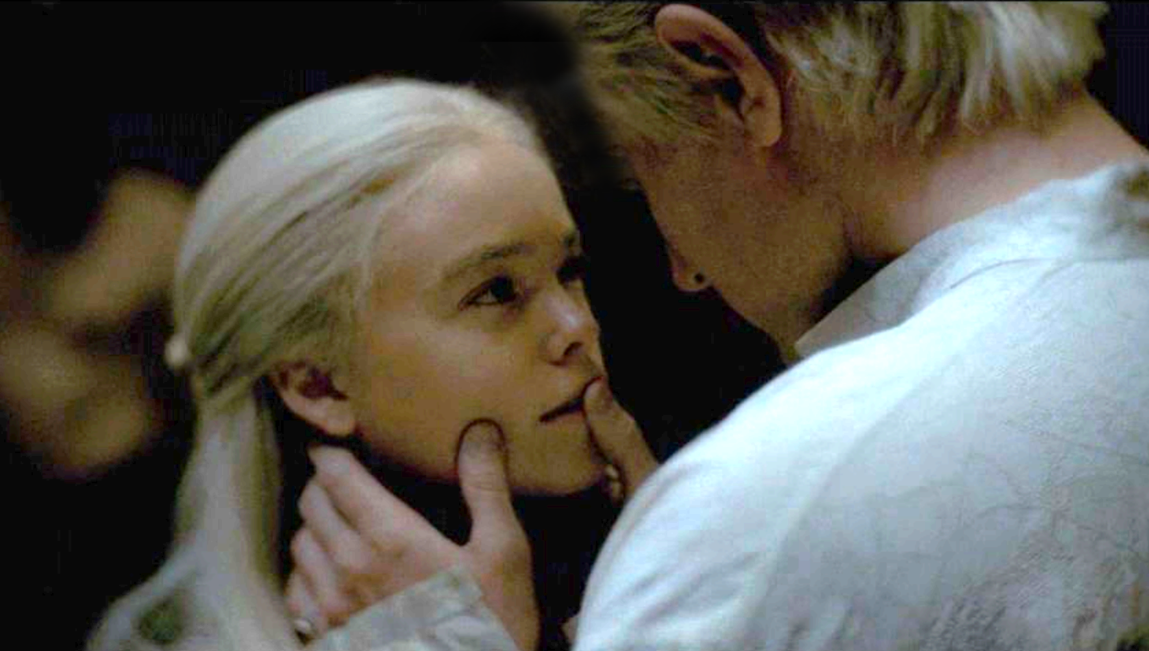 Daemon holding Rhaenyra's face