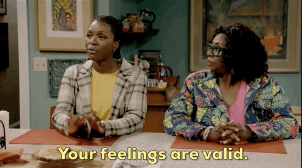 two women at a table with the words,  &quot;Your feelings are valid&quot;