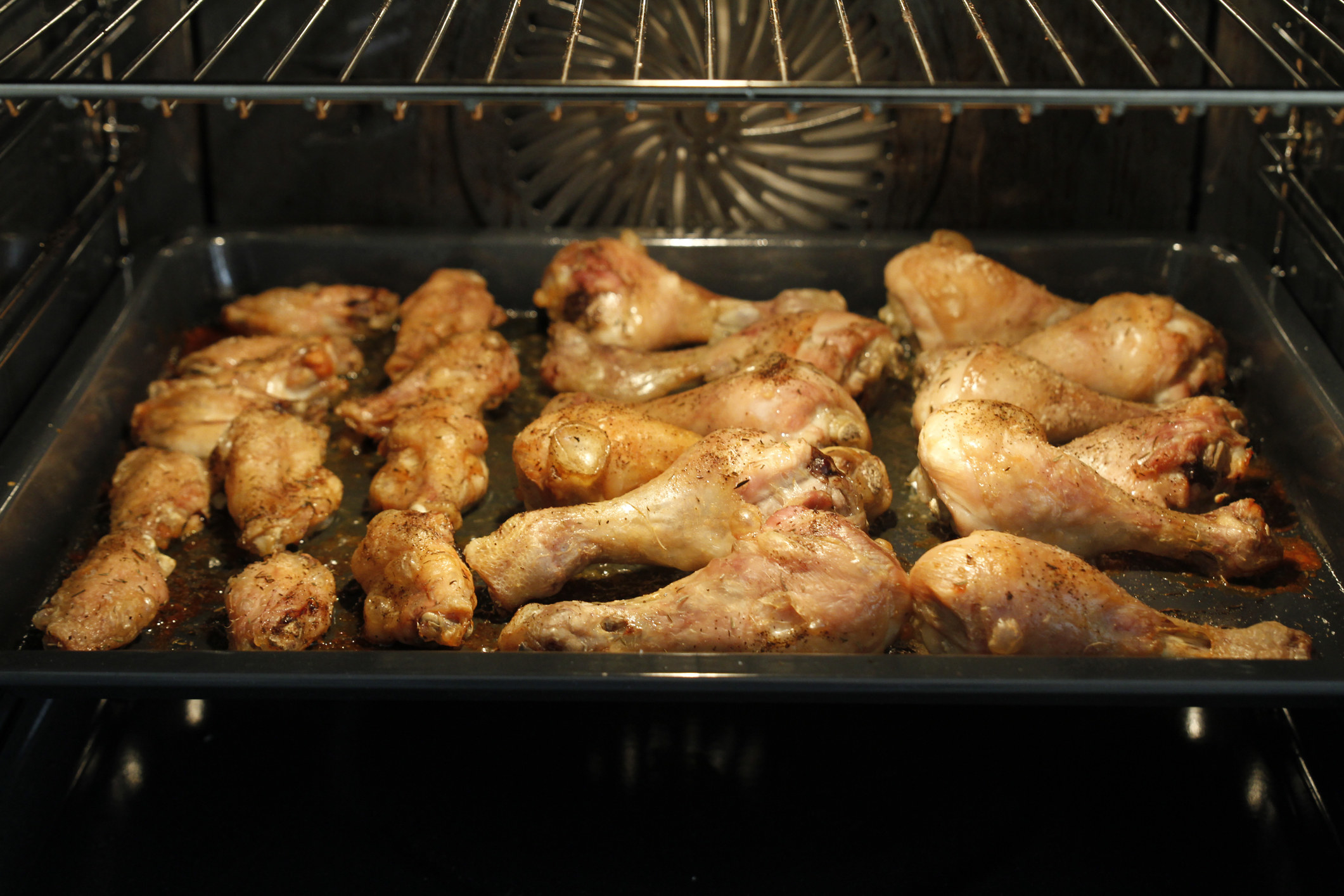 Chicken wings and thighs roasting