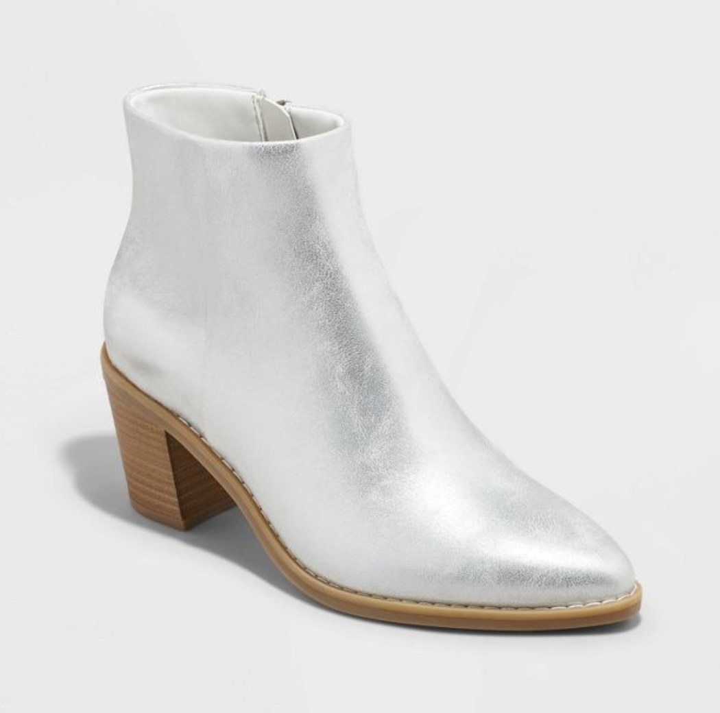 The boots are shown in the pearlescent silver option