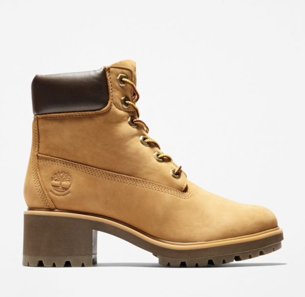 The yellow-tan boots have the circular Timberland logo above the heel