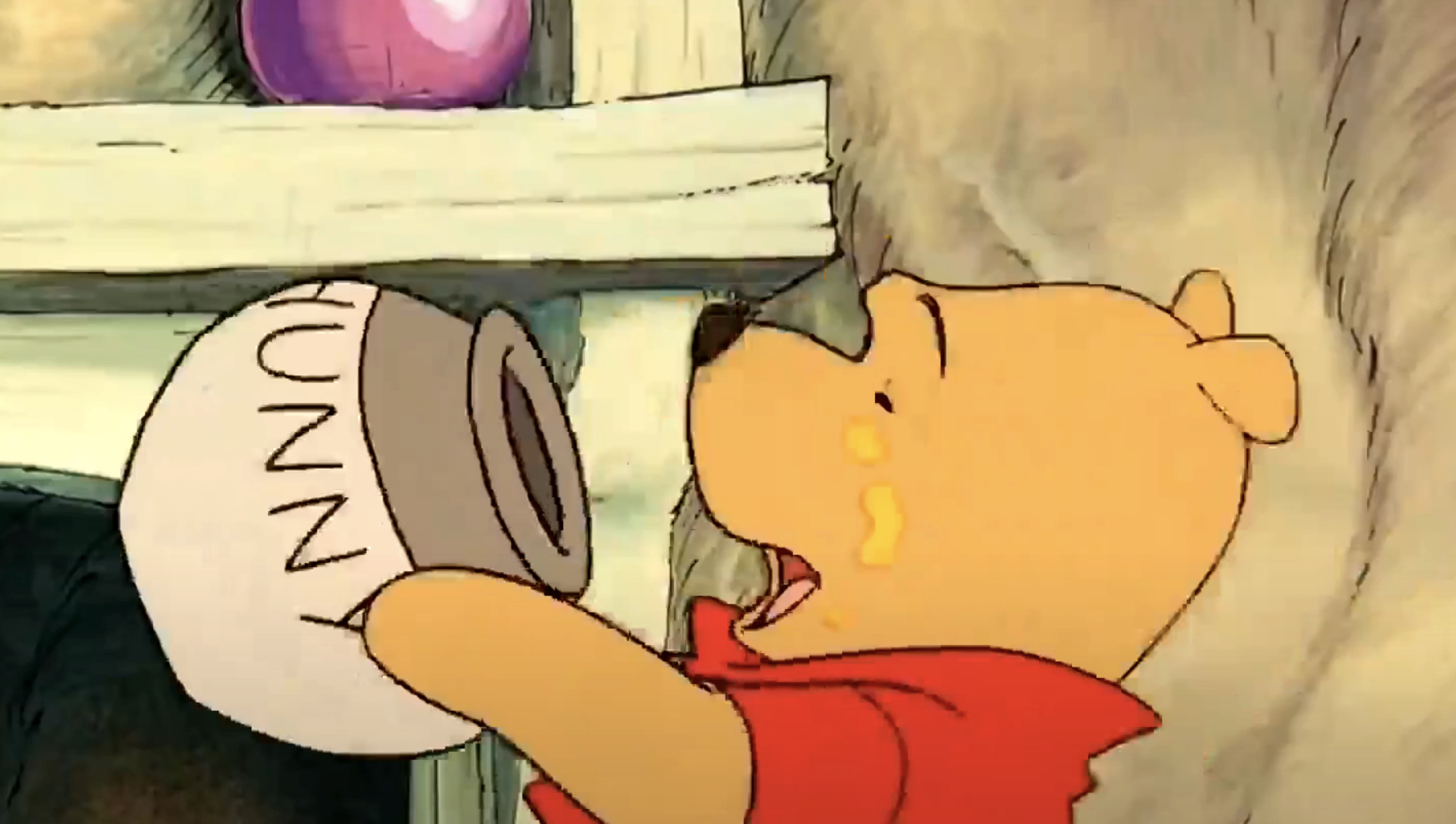 Winnie the Pooh drinking from a jar of honey