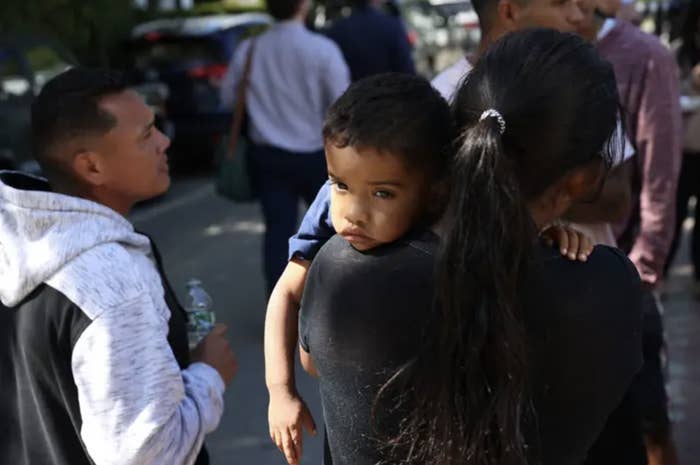 a young child being carried by his parent