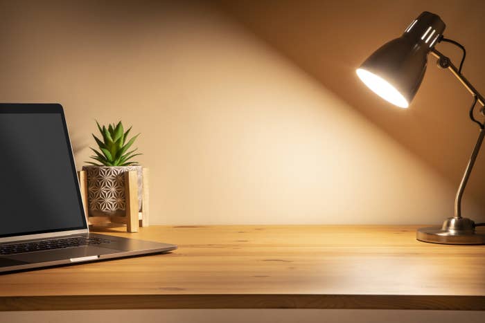 desk with lamp and laptop