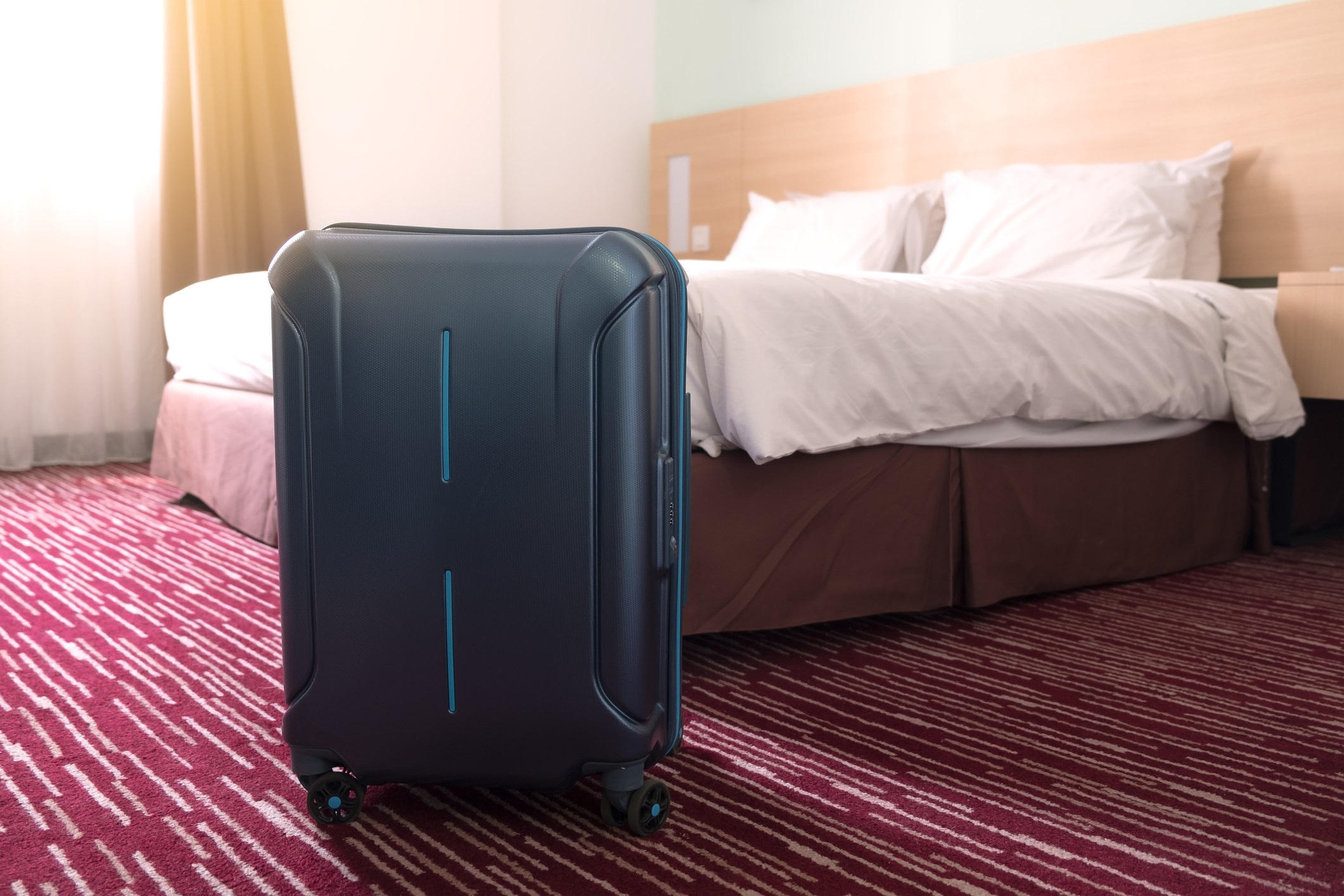 A suitcase in a hotel room