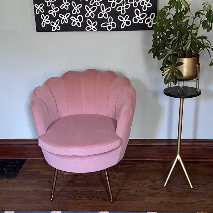 A pink barrel chair in a home