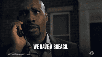 A man talking on the phone and saying &quot;We have a breach&quot;