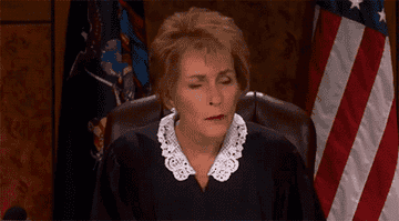 Judge Judy listening impatiently