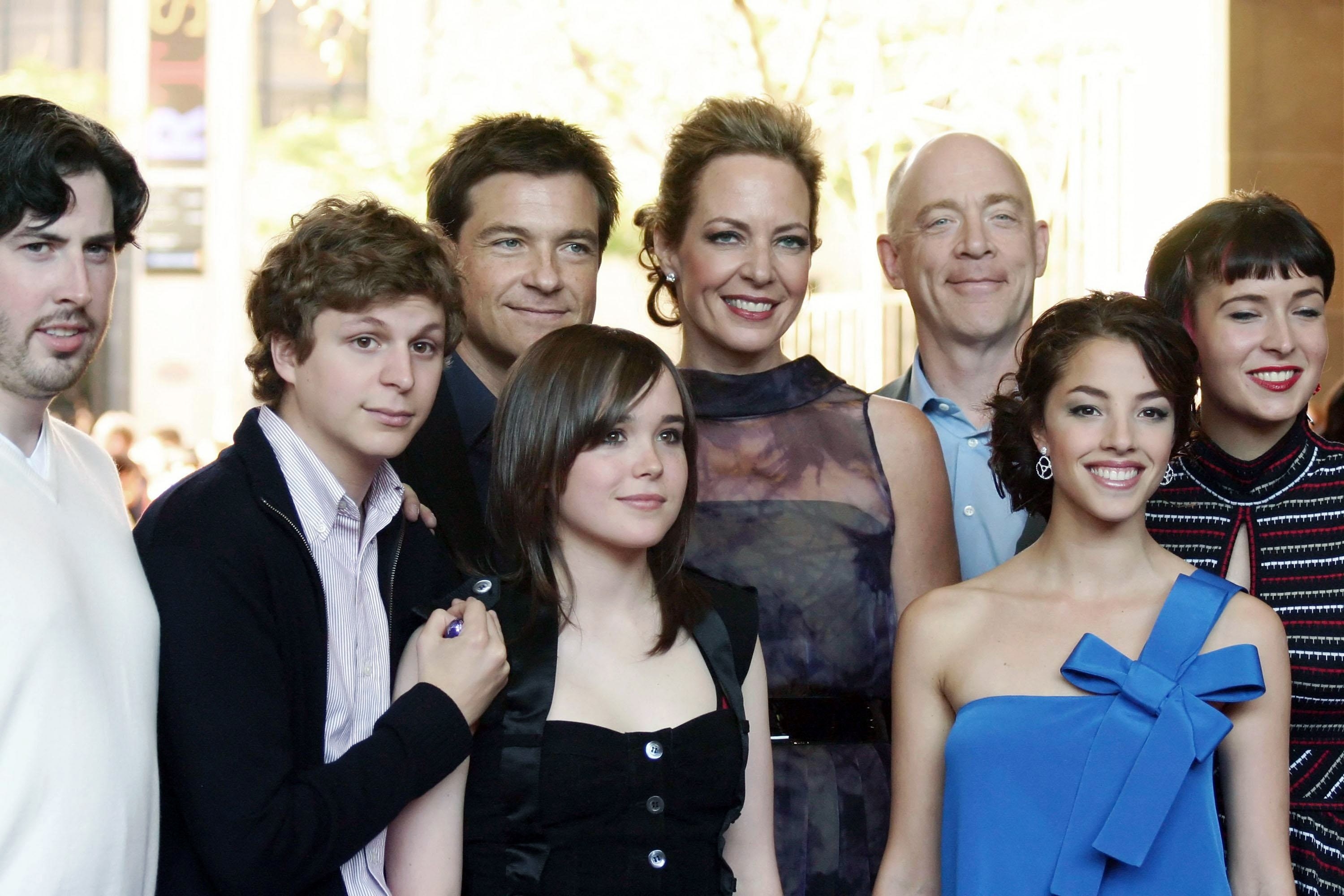the cast taking a group photo