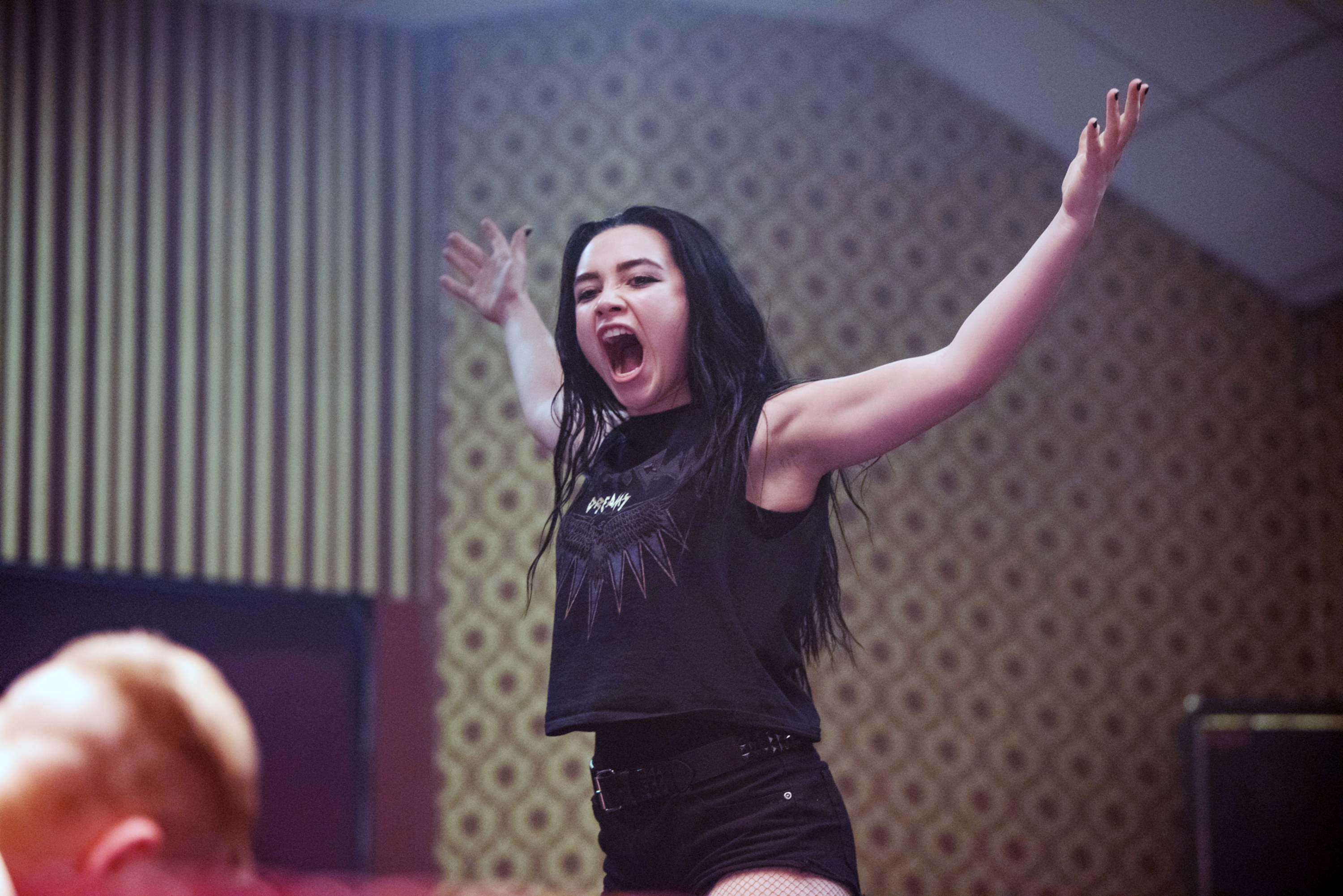 Florence Pugh shouts while wrestling