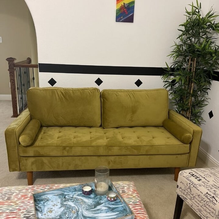 A green sofa in a home