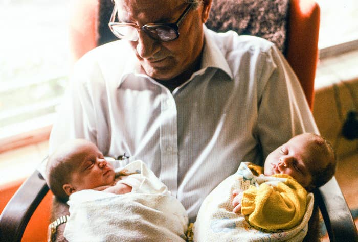 A grandfather holds babies