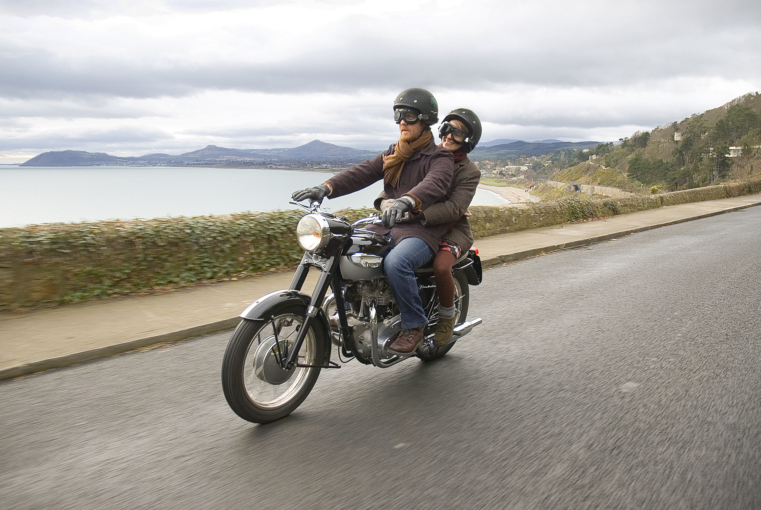 a couple on a motorcycle