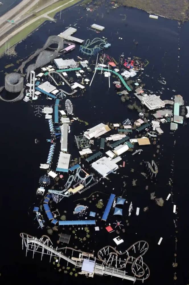 A large area is underwater, but with roller coasters and other rides rising up out of the water