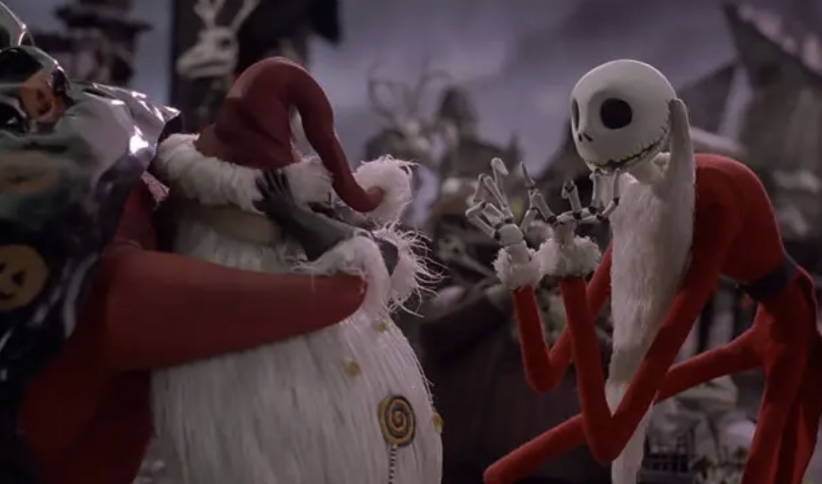 Santa hiding his face from a skeleton