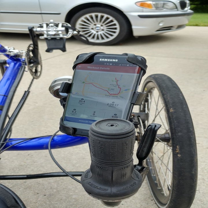 Close-up of another reviewer's phone attached in mount showing directions