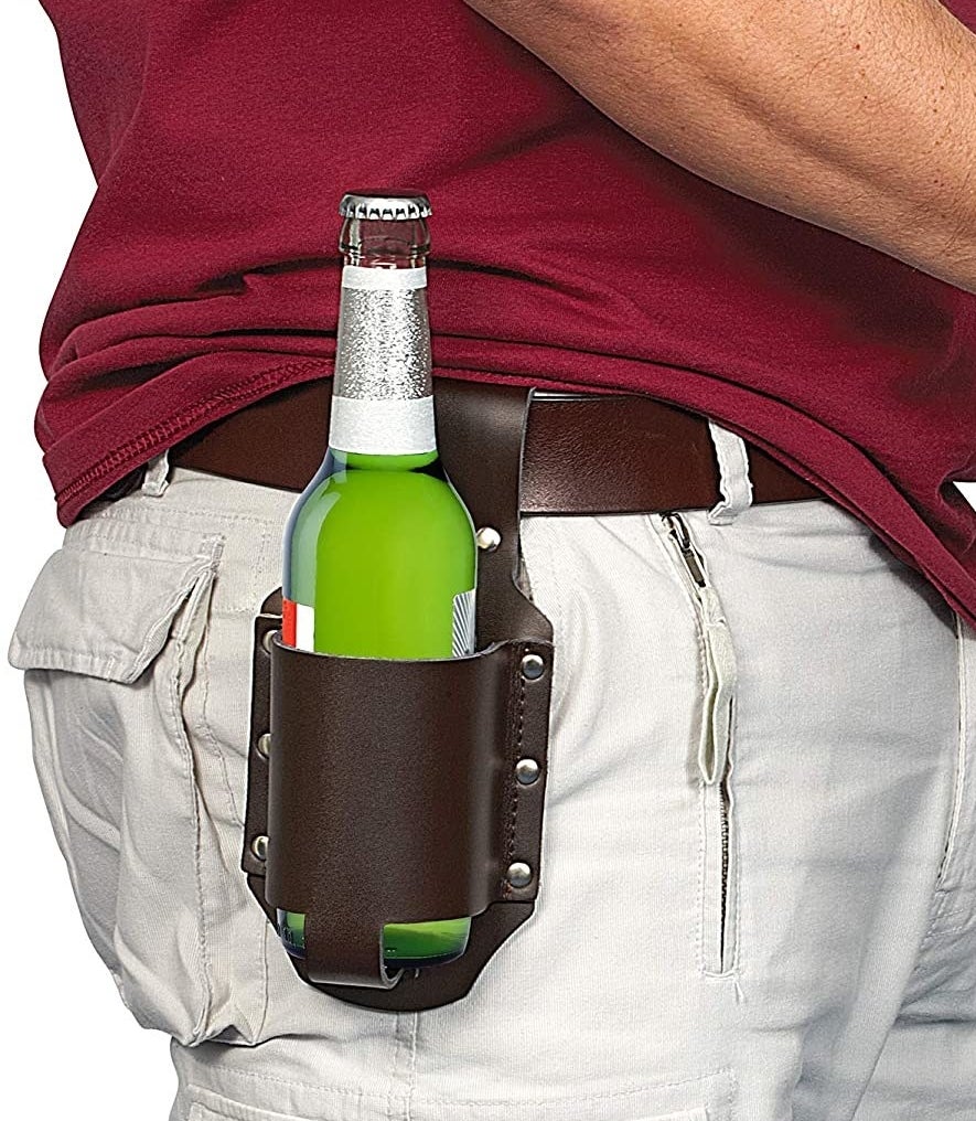 a person carrying a beer bottle on the belt holster