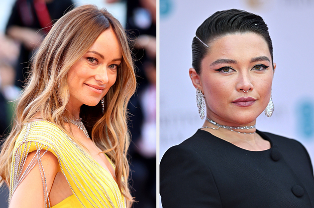 Olivia Wilde wears a yellow gown with silver gems hanging off the shoulders and matching jewelry. Florence Pugh wears a black dress with a silver choker, dangling earrings, and winged eyeliner.