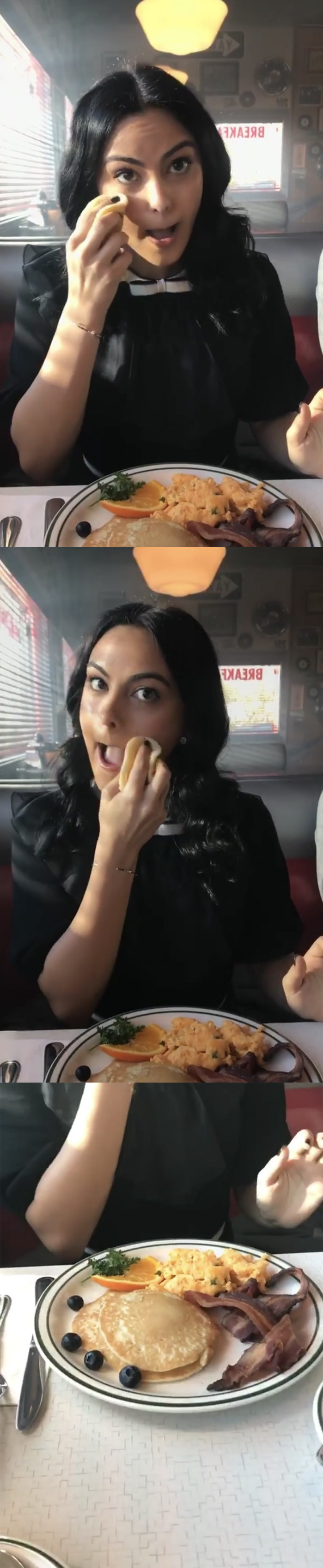Camila Mendes wiping her face with a fake pancake