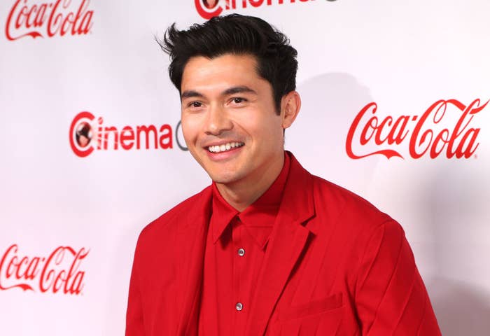 Henry smiling in red shirt and jacket