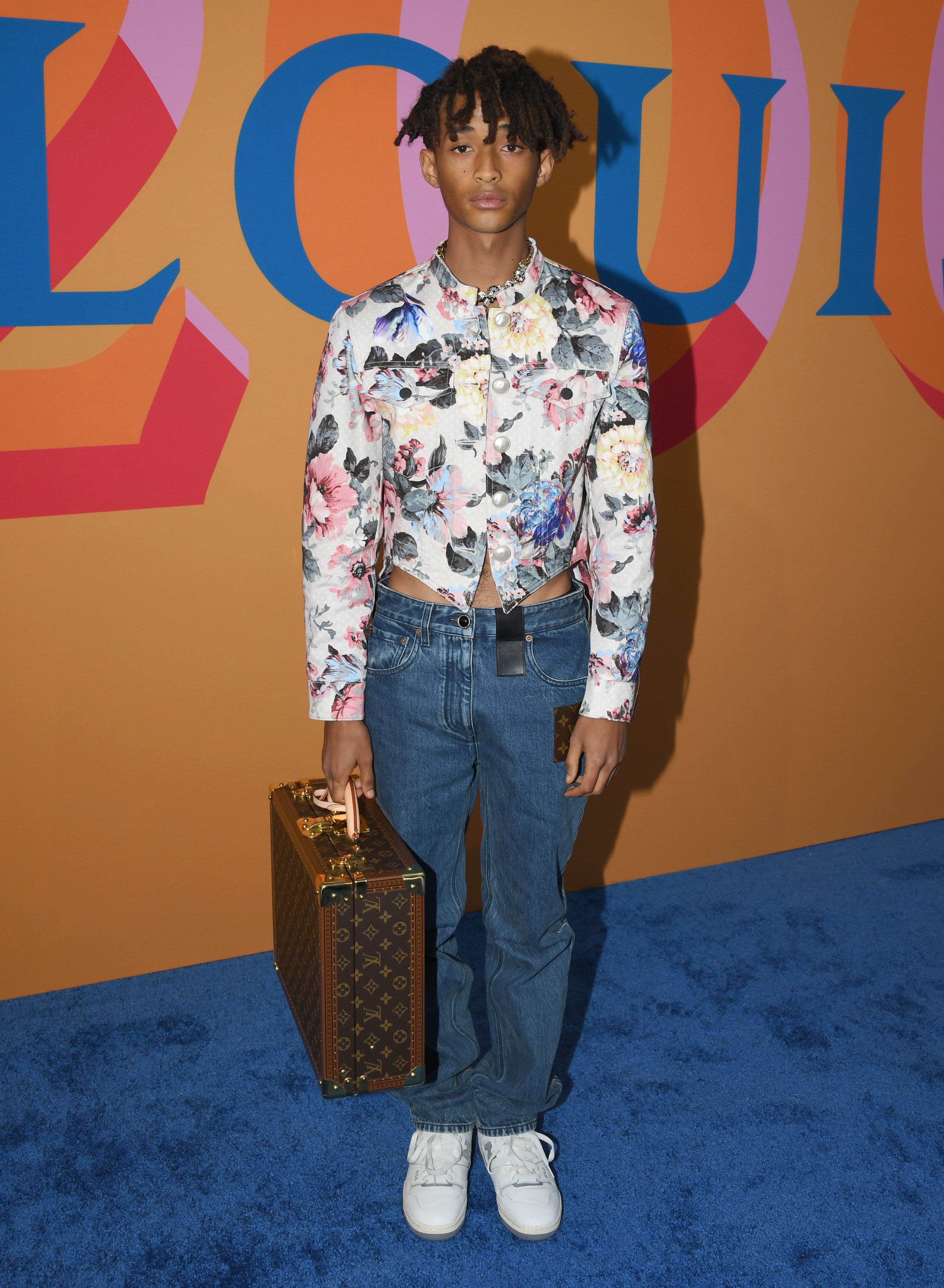 Jaden in jeans and a flowery top
