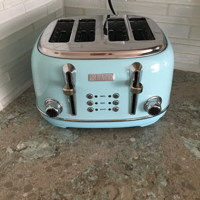 reviewer&#x27;s picture of the light blue toaster
